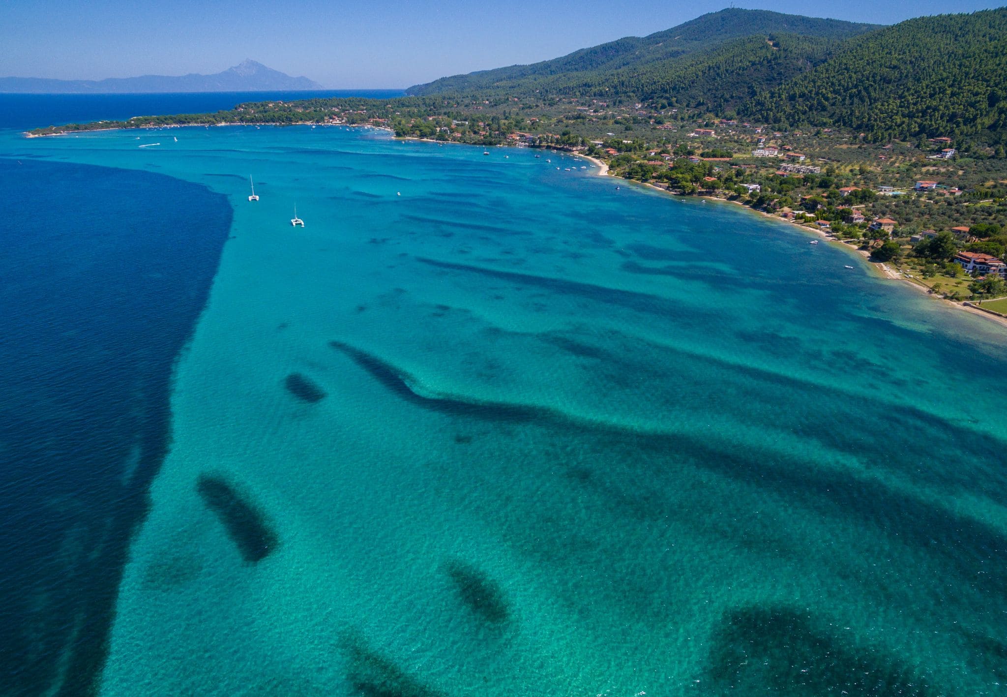 Long Vourvourou coastline and clear shallow sea, Halkidiki