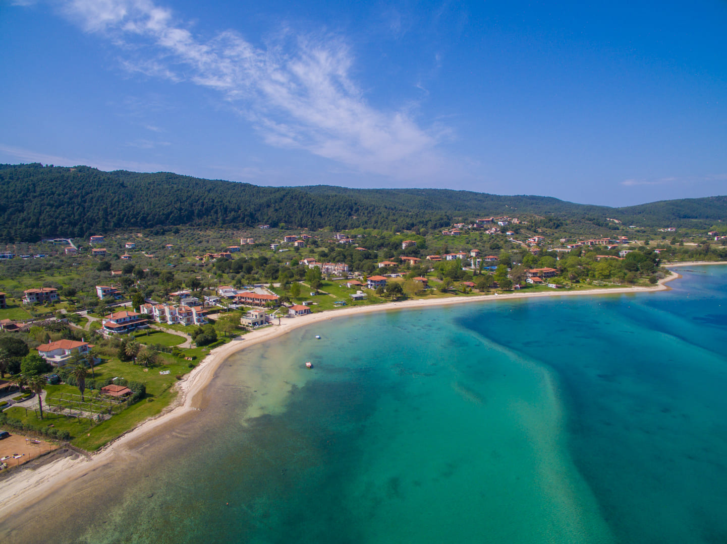 Sandy beach and village of Vourvourou seen from above, Halkidiki