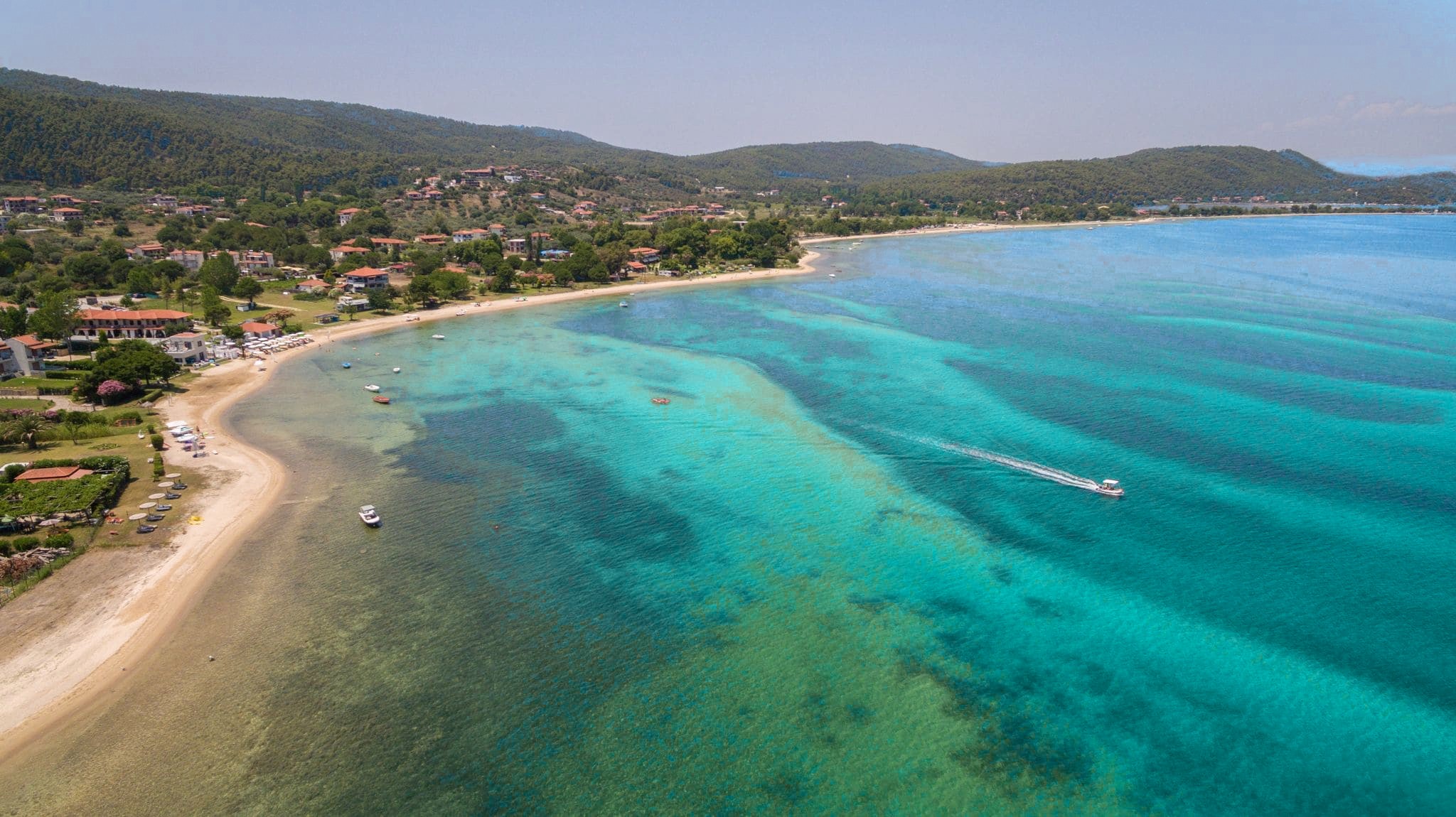 Shallow turquoise water along the Vourvourou beach, Sithonia
